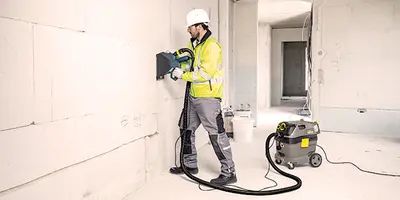 An image showcasing a high-pressure device effectively blasting away grime from outdoor surfaces, highlighting its powerful cleaning capabilities.