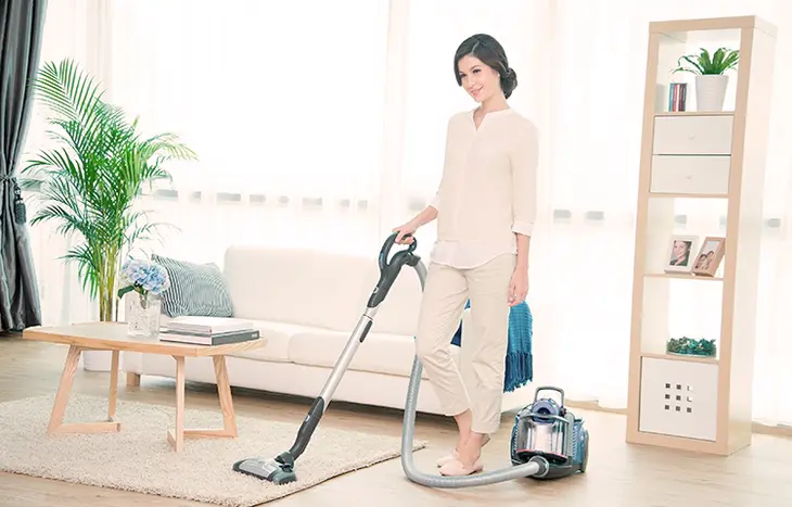 A close-up photo of a steam cleaner releasing steam to sanitize and disinfect a surface without harsh chemicals.