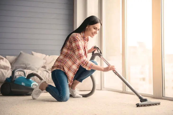 A close-up photo of a steam cleaner sanitizing indoor surfaces, emphasizing its chemical-free cleaning method.