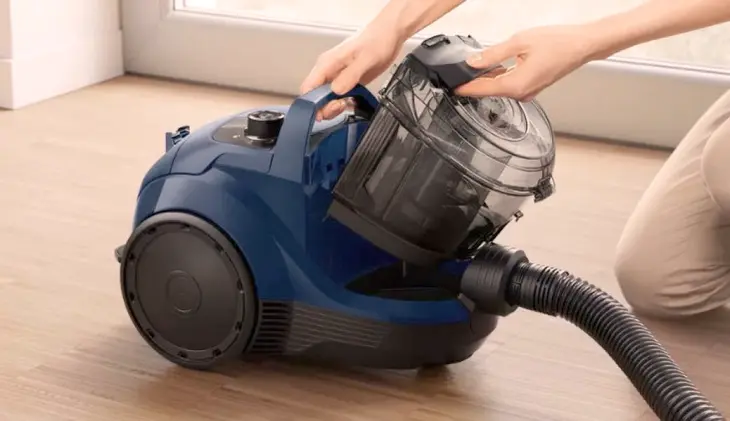 A close-up photo of a steam cleaner sanitizing indoor surfaces, highlighting its chemical-free cleaning method.