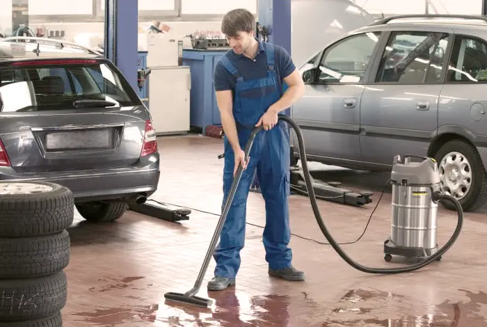 A close-up photo of a steam cleaner releasing steam to sanitize a surface without harsh chemicals.