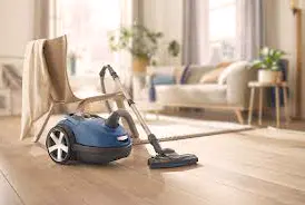 A close-up photo of a steam cleaner sanitizing indoor surfaces, emphasizing its chemical-free cleaning method.