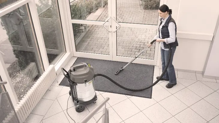 An image showcasing a high-pressure device effectively blasting away grime from outdoor surfaces, highlighting its powerful cleaning capabilities.